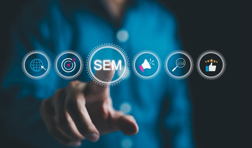 Search engine marketing concept with user touching digital SEM icons representing ads, targeting, and analytics